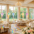 a wedding reception with prism suncatchers having transparent colored centers