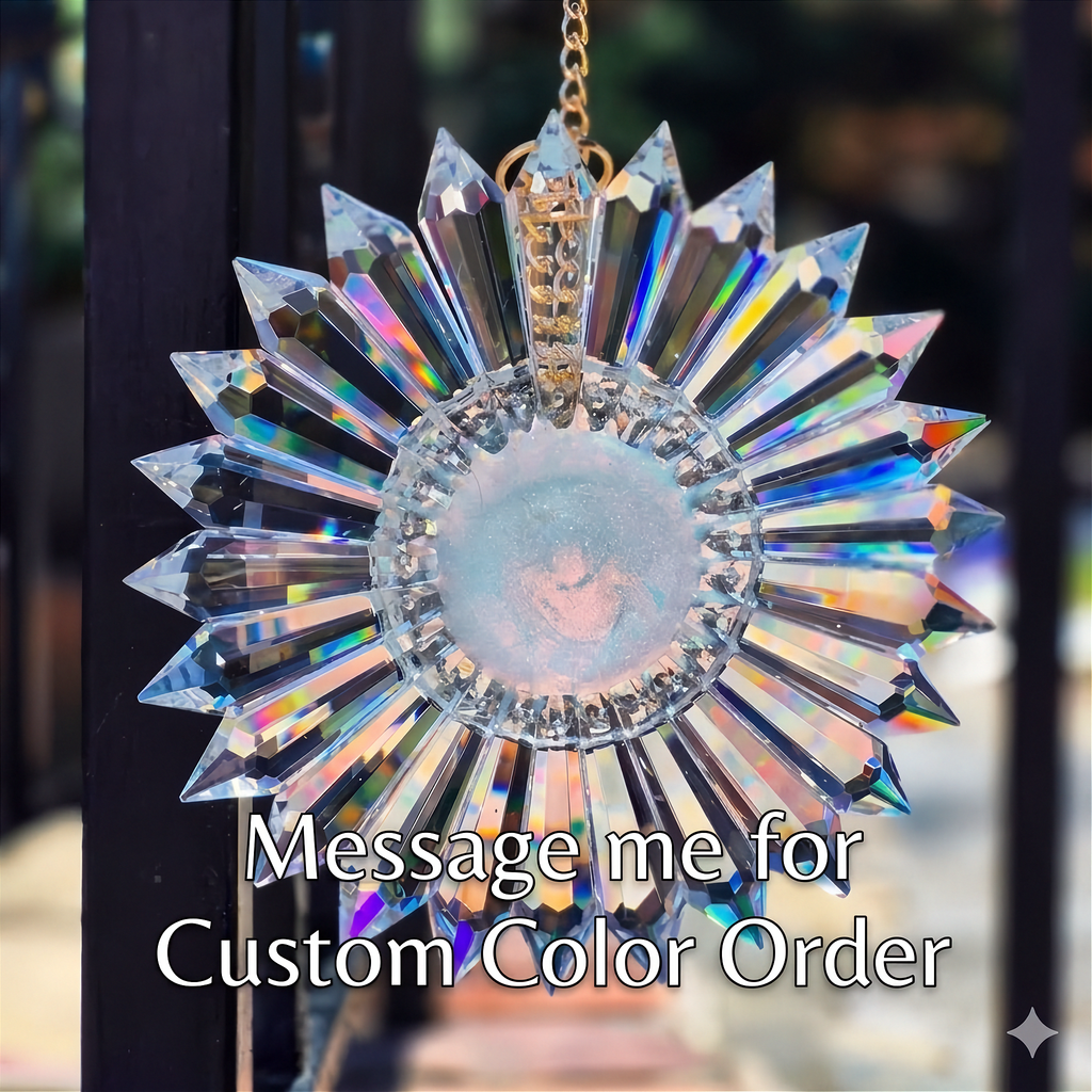 A faceted crystal sunburst suncatcher with a gold-tone chain and central opalescent center, shown hanging outdoors with a text overlay that reads 'Message me for Custom Color Order'.