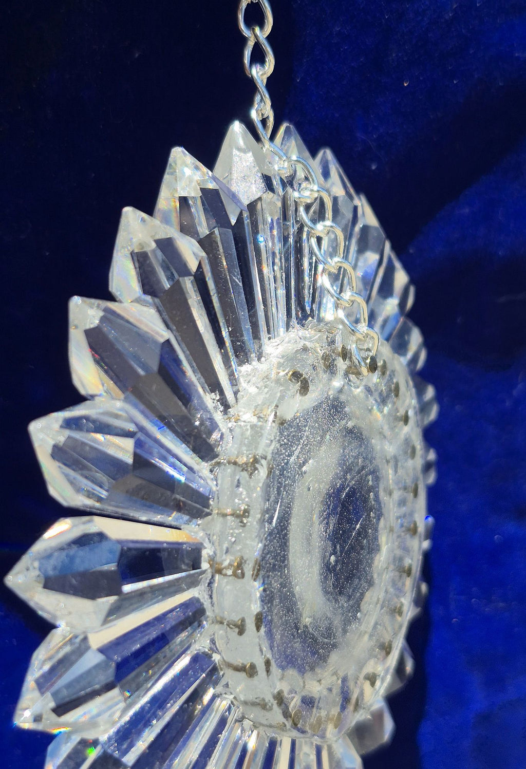 oblique side view of 5-inch prism suncatcher with blue background