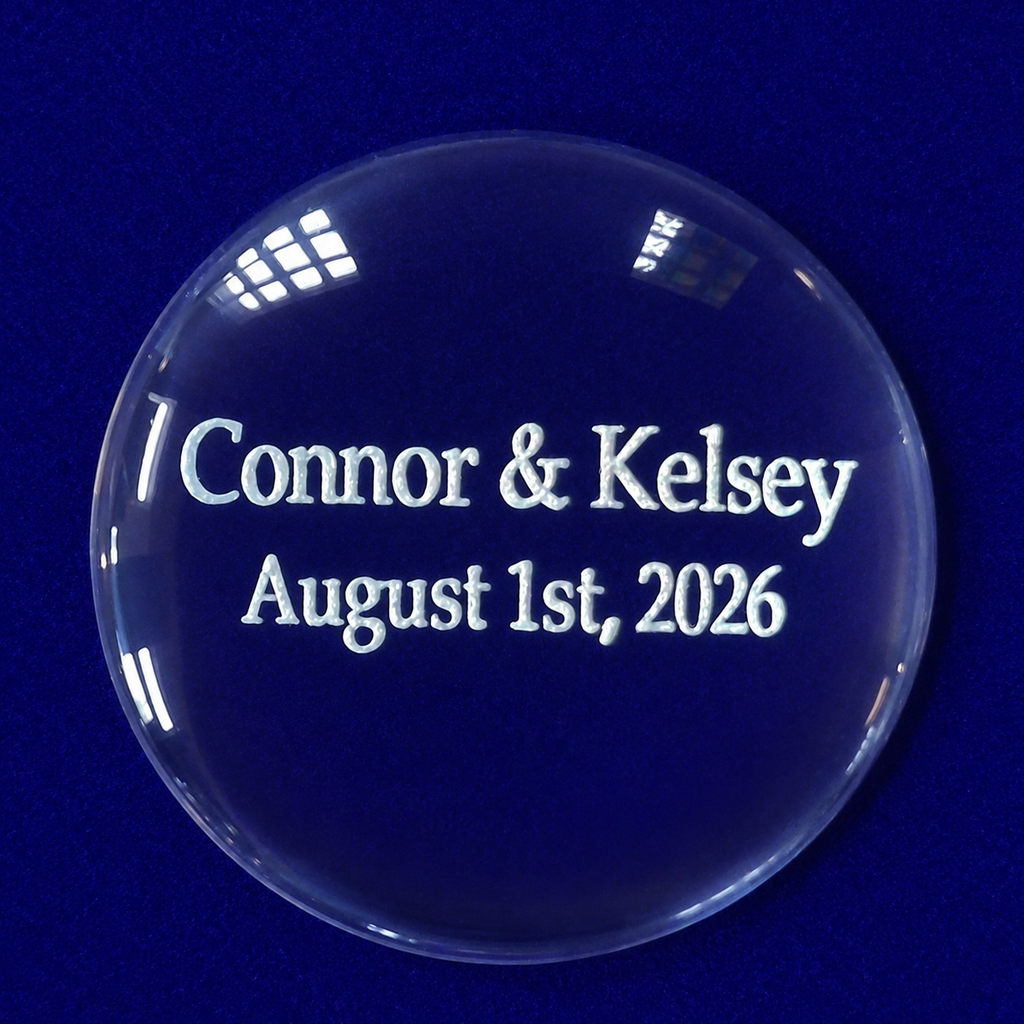round glass disc with names and wedding date engraved in white